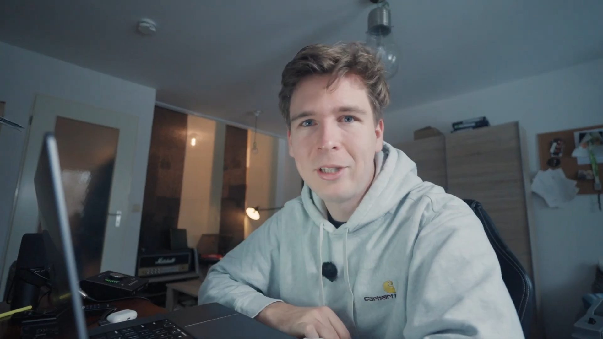 Creator talking to camera at his desk